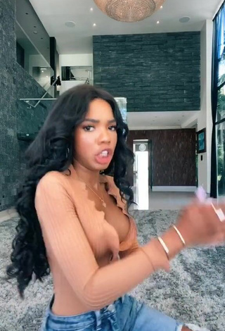 4. Hot Teala Dunn Shows Cleavage in Peach Top