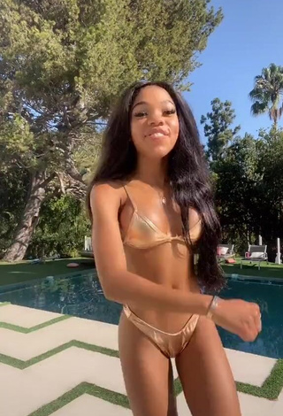 1. Pretty Teala Dunn Shows Cleavage in Golden Bikini at the Swimming Pool