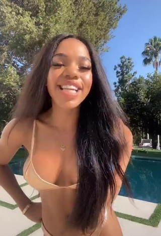 4. Pretty Teala Dunn Shows Cleavage in Golden Bikini at the Swimming Pool