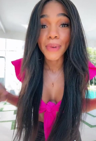 3. Cute Teala Dunn Shows Cleavage in Firefly Rose Crop Top