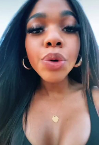 Sexy Teala Dunn Shows Cleavage in Black Top