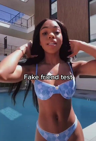 Sexy Teala Dunn Shows Cleavage in Floral Bikini at the Swimming Pool