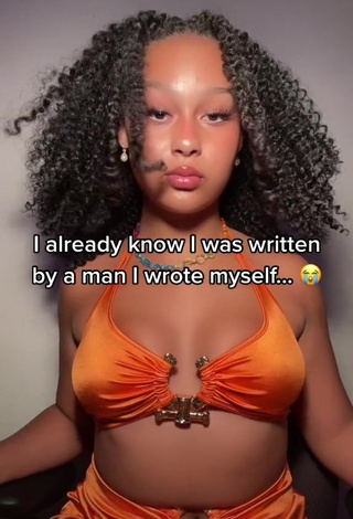 1. Cute Veondre Mitchell Shows Cleavage in Orange Crop Top