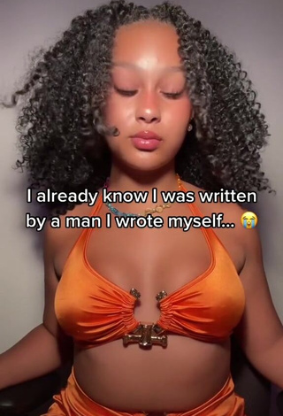 Cute Veondre Mitchell Shows Cleavage in Orange Crop Top