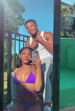 Hot Bria Alana Shows Cleavage in Violet Bikini