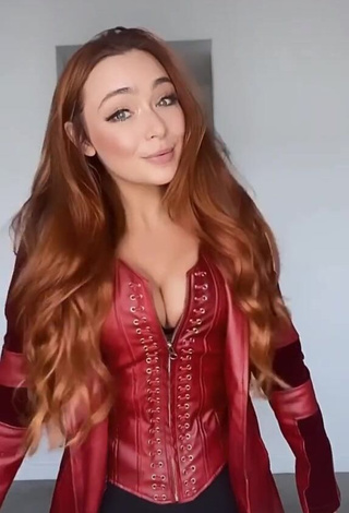 Hot Caitlin Christine Shows Cleavage in Red Corset