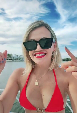 3. Sexy Fanny Lu Shows Cleavage in Red Bikini Top on a Boat