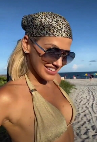 1. Hot Fanny Lu in Golden Bikini at the Beach