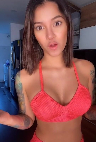 Cute Jenn Muriel Shows Cleavage in Orange Sport Bra