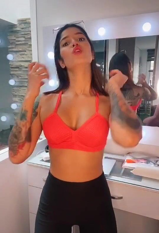 1. Amazing Jenn Muriel Shows Cleavage in Hot Orange Sport Bra