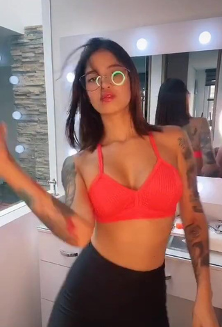 4. Amazing Jenn Muriel Shows Cleavage in Hot Orange Sport Bra