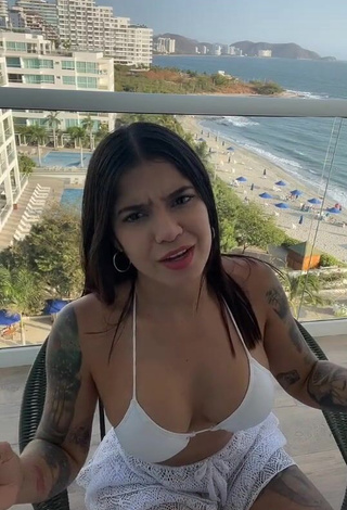 Erotic Jenn Muriel Shows Cleavage in White Bikini Top on the Balcony