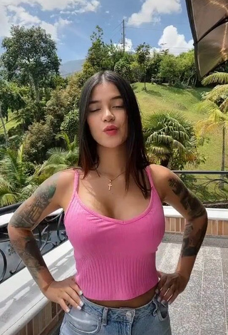 3. Cute Jenn Muriel Shows Cleavage in Pink Crop Top on the Balcony