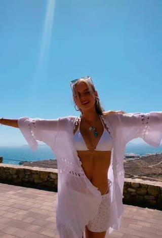 4. Sexy Jessica Belkin Shows Cleavage in White Bikini Top on the Balcony