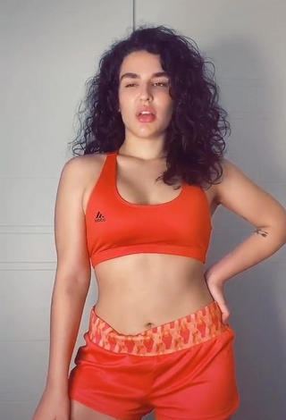 1. Sexy Kefera Buchmann Shows Cleavage in Orange Sport Bra