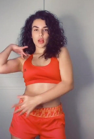 3. Sexy Kefera Buchmann Shows Cleavage in Orange Sport Bra