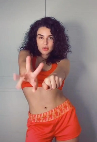 4. Sexy Kefera Buchmann Shows Cleavage in Orange Sport Bra