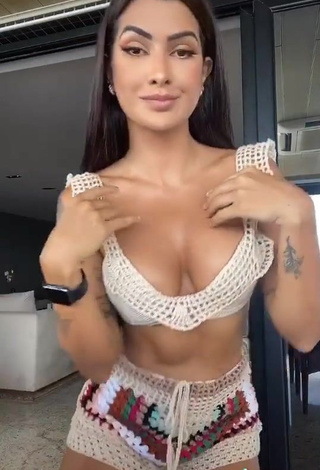 Sexy Marina Ferrari Shows Cleavage in Beige Bikini Top