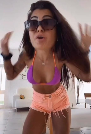 1. Beautiful Marina Ferrari Shows Cleavage in Sexy Violet Bikini Top