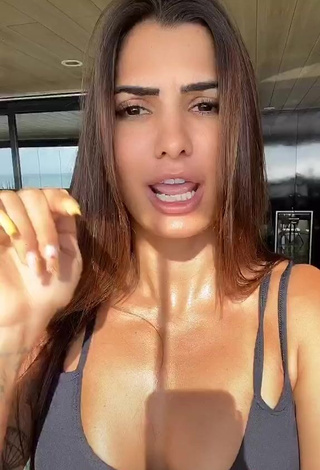 4. Hot Marina Ferrari Shows Cleavage in Black Sport Bra