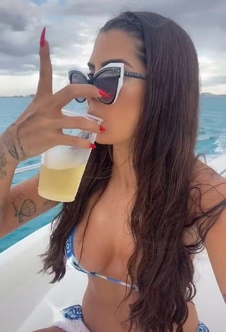 3. Sexy Marina Ferrari Shows Cleavage in Bikini on a Boat