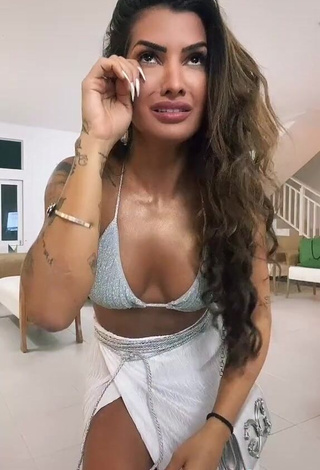 4. Alluring Marina Ferrari Shows Cleavage in Erotic Silver Bikini Top