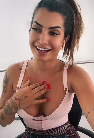 Desirable Marina Ferrari Shows Cleavage in Pink Crop Top