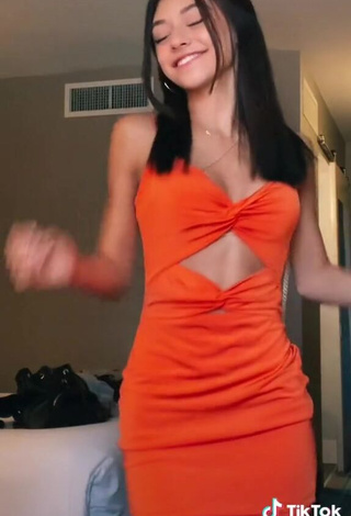 4. Sexy Rachel Brockman in Orange Dress