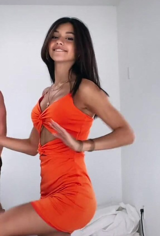 Hot Rachel Brockman Shows Cleavage in Orange Dress