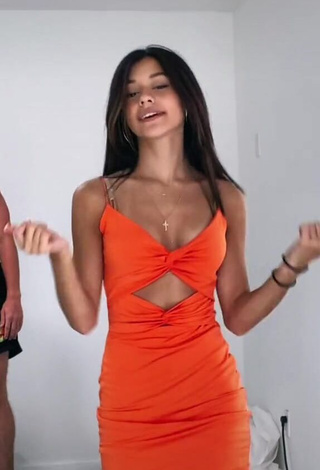 3. Hot Rachel Brockman Shows Cleavage in Orange Dress