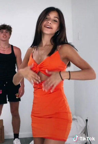 4. Hot Rachel Brockman Shows Cleavage in Orange Dress