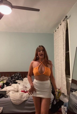 Hot Noel LaPalomento Shows Cleavage in Orange Bikini Top