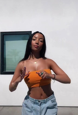 1. Hot Alessya Farrugia Shows Cleavage in Orange Tube Top