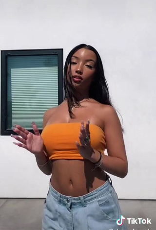 4. Hot Alessya Farrugia Shows Cleavage in Orange Tube Top