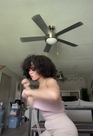 4. Hot Arielle Tara Shows Cleavage in Pink Top