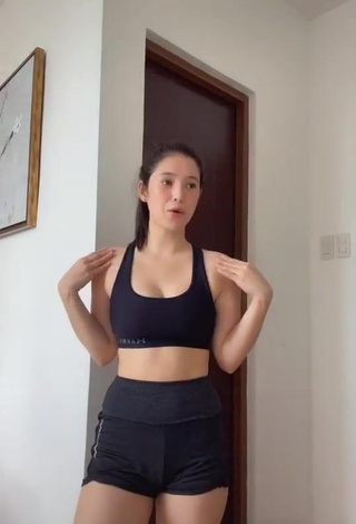 Hot Barbie Imperial Shows Cleavage in Black Sport Bra