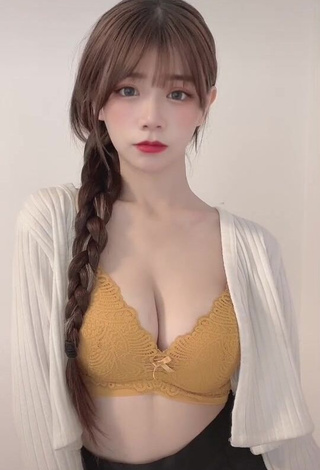 Hot c.0214 Shows Cleavage in Yellow Bra