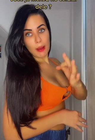 1. Desirable Dine Azevedo Shows Cleavage in Orange Crop Top