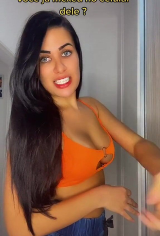 Desirable Dine Azevedo Shows Cleavage in Orange Crop Top