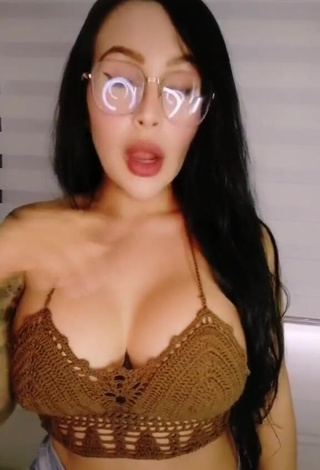 1. Erotic Eve Herrera Shows Cleavage in Brown Crop Top