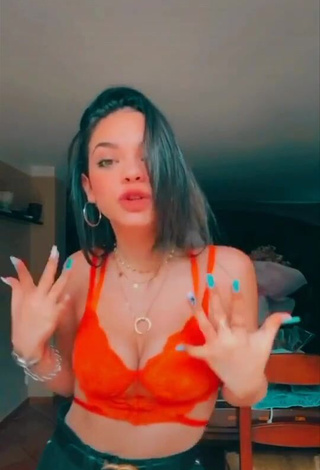 3. Sexy Giulia Paglianiti Shows Cleavage in Electric Orange Bra