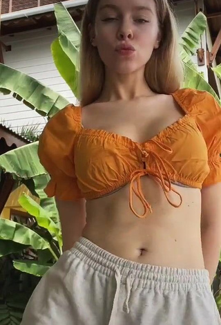 4. Desirable Ira Blanc in Orange Crop Top