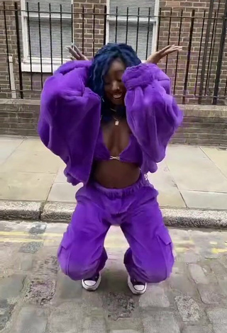 4. Hot Oluwanifewa Agunbiade Shows Cleavage in Violet Bikini Top in a Street