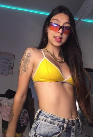 1. Julia Guerra Shows Cleavage in Seductive Yellow Sport Bra