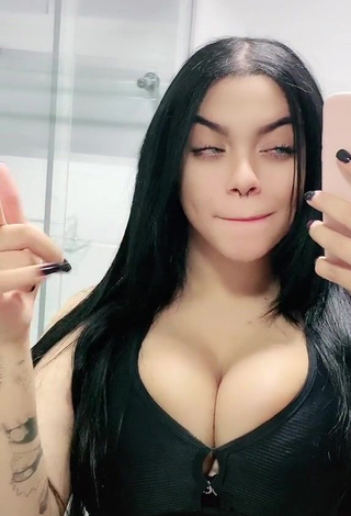 Seductive Karniello Shows Cleavage in Black Bra