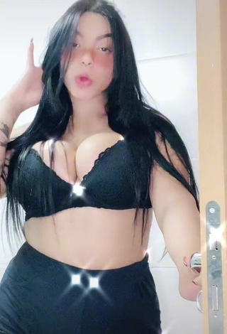 3. Karniello Shows Cleavage in Sexy Black Bra