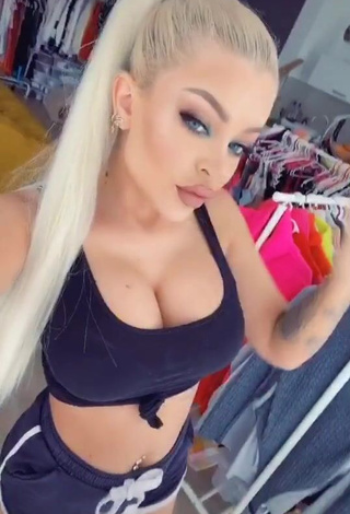 Desirable Katja Krasavice Shows Cleavage in Black Crop Top