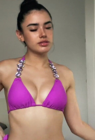 1. Cute Kiara Brunett Shows Cleavage in Violet Bikini