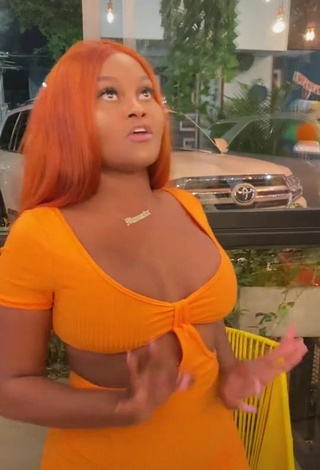 Sexy Lajesuu Shows Cleavage in Orange Dress