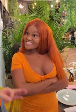 3. Sexy Lajesuu Shows Cleavage in Orange Dress